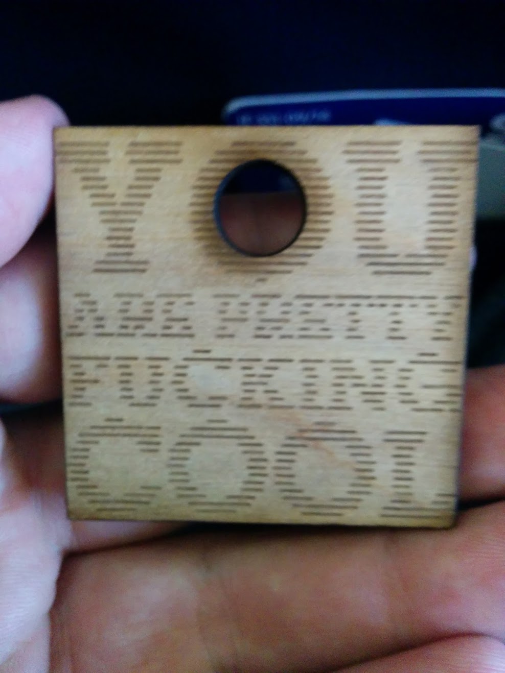 a small necklace that says 'you are pretty fucking cool' on it